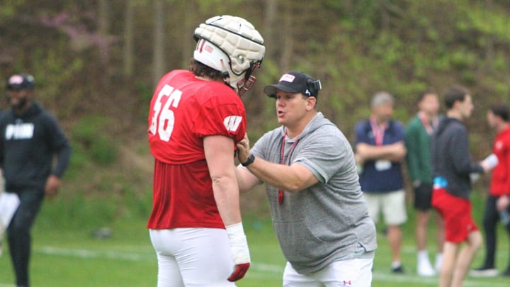 Wisconsin offensive line coach AJ Blazek works with guard Joe Brunner during the team's final spring practice, which was held on the field north of Camp Randall Stadium on Thursday May 2, 2024 in Madison, Wisconsin.