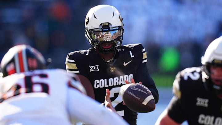 Nov 29, 2024; Boulder, Colorado, USA; Colorado Buffaloes quarterback Shedeur Sanders (2) takes a hike in the first quarter against the Oklahoma State Cowboys at Folsom Field.  