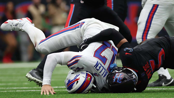 Oct 6, 2024; Houston, Texas, USA;  Buffalo Bills quarterback Josh Allen (17) gets hit by Houston Texans safety Jalen Pitre (5) in the second half at NRG Stadium.