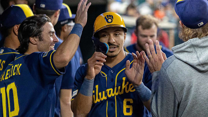 Apr 21, 2026; Detroit, Michigan, USA; Milwaukee Brewers second baseman David Hamilton (6) hi-fives teammates after scoring a run against the Detroit Tigers during the seventh inning at Comerica Park. Mandatory Credit: David Reginek-Imagn Images