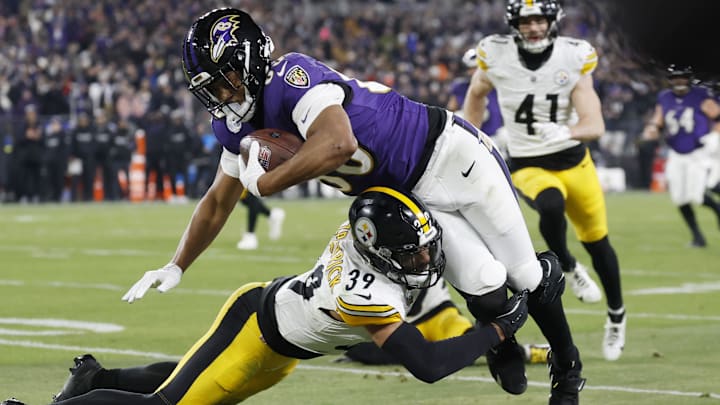 Jan 11, 2025; Baltimore, Maryland, USA; Baltimore Ravens tight end Isaiah Likely (80) runs against Pittsburgh Steelers safety Minkah Fitzpatrick (39) in the second quarter in an AFC wild card game at M&T Bank Stadium. Mandatory Credit: Geoff Burke-Imagn Images Jan 11, 2025; Baltimore, Maryland, USA; Baltimore Ravens tight end Isaiah Likely (80) runs against Pittsburgh Steelers safety Minkah Fitzpatrick (39) in the second quarter in an AFC wild card game at M&T Bank Stadium. Mandatory Credit: Geoff Burke-Imagn Images
