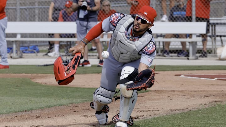 Feb 16, 2026; Jupiter, FL, USA;  St. Louis Cardinals catcher Ivan Herrera (48) fields a ball during spring training workouts at Roger Dean Stadium. Mandatory Credit: Reinhold Matay-Imagn Images