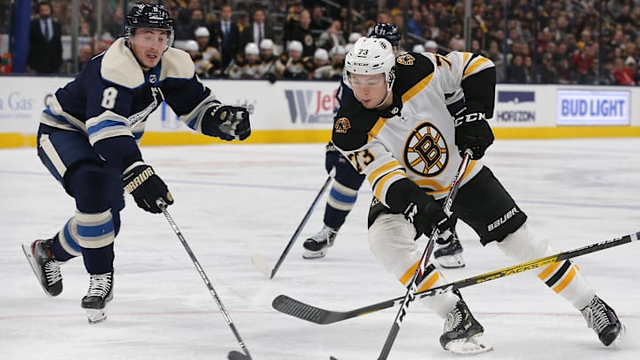 Jan 14, 2020; Columbus, Ohio, USA; Boston Bruins defenseman Charlie McAvoy (73) breaks toward the gaol as Columbus Blue Jackets defenseman Zach Werenski (8) defends during the third period at Nationwide Arena. Mandatory Credit: Russell LaBounty-Imagn Images