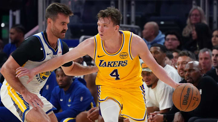 Oct 5, 2025; San Francisco, California, USA; Los Angeles Lakers forward Dalton Knecht (4) is defended by Golden State Warriors guard Pat Spencer (61) in the third quarter at Chase Center. Mandatory Credit: David Gonzales-Imagn Images Oct 5, 2025; San Francisco, California, USA; Los Angeles Lakers forward Dalton Knecht (4) is defended by Golden State Warriors guard Pat Spencer (61) in the third quarter at Chase Center. Mandatory Credit: David Gonzales-Imagn Images