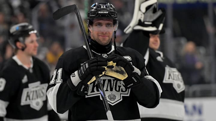 Apr 23, 2025; Los Angeles, California, USA; Los Angeles Kings center Anze Kopitar (11) makes a heart with his gloves for he daughter after defeating the Edmonton Oilers in game 2 of the 2025 Stanley Cup Playoffs at Crypto.com Arena. Mandatory Credit: Jayne Kamin-Oncea-Imagn Images