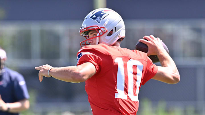 Jul 28, 2025; Foxborough, MA, USA; New England Patriots quarterback Drake Maye (10) throws a pass during training camp at Gillette Stadium. Mandatory Credit: Eric Canha-Imagn Images