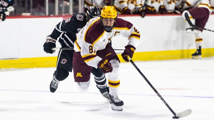 Minnesota forward Jimmy Snuggerud, front, skates with the puck against Omaha during the Ice Breaker Tournament on Oct. 12, 2024, in Las Vegas. 
