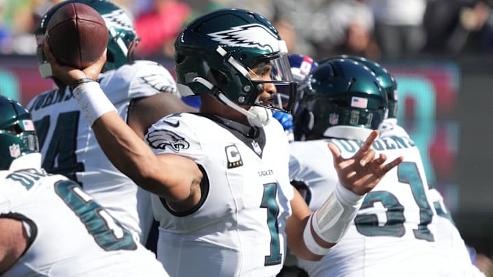 Oct 20, 2024; East Rutherford, New Jersey, USA;  Philadelphia Eagles quarterback Jalen Hurts (1) throws against the New York Giants during the first half at MetLife Stadium.  