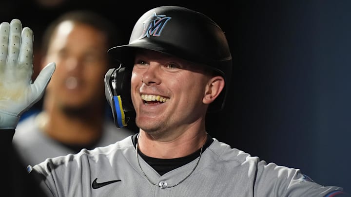 Miami Marlins right fielder Troy Johnston (75) celebrates after scoring a run.