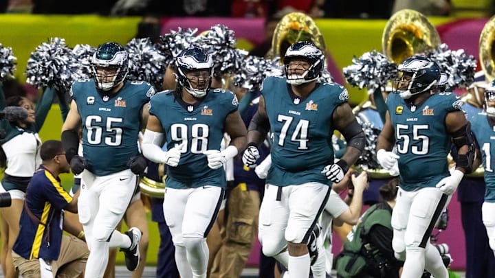 Feb 9, 2025; New Orleans, LA, USA; Philadelphia Eagles offensive tackle Lane Johnson (65), defensive end Jalen Carter (98), offensive tackle Fred Johnson (74) and defensive end Brandon Graham (55) enter the field prior to game against the Kansas City Chiefs during Super Bowl LIX at Ceasars Superdome. Mandatory Credit: Mark J. Rebilas-Imagn Images