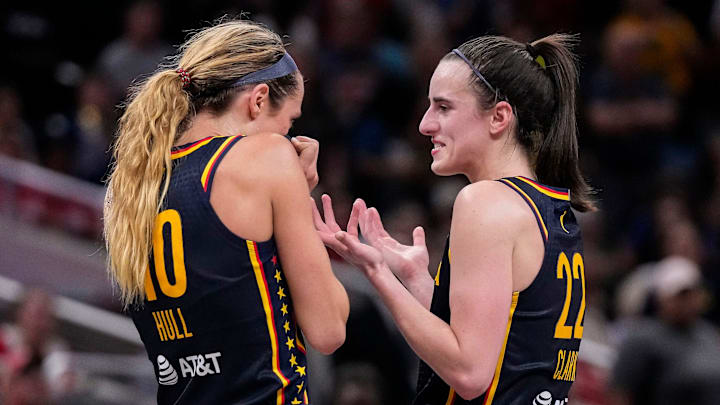 Indiana Fever guard Caitlin Clark (22) and Indiana Fever guard Lexie Hull (10) talk during a timeout on Sunday, Sept. 15, 2024, during the game at Gainbridge Fieldhouse in Indianapolis. The Indiana Fever defeated the Dallas Wings, 110-109.