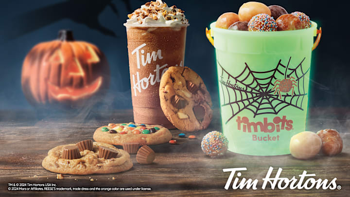 Get Your Halloween Treats and Glow-in-the-Dark Buckets at Tim Hortons! 🎃🍫 Image Credit to Tim Hortons. 