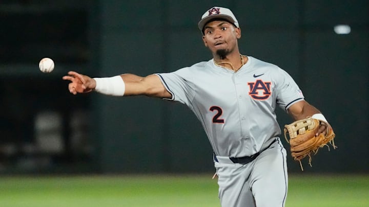 March 27, 2026; Tuscaloosa, AL, USA; Auburn second baseman Chris Rembert (2) throws to first for an out at Sewell-Thomas Stadium as the Crimson Tide and Auburn Tigers played the first game of their three-game series. March 27, 2026; Tuscaloosa, AL, USA; Auburn second baseman Chris Rembert (2) throws to first for an out at Sewell-Thomas Stadium as the Crimson Tide and Auburn Tigers played the first game of their three-game series.
