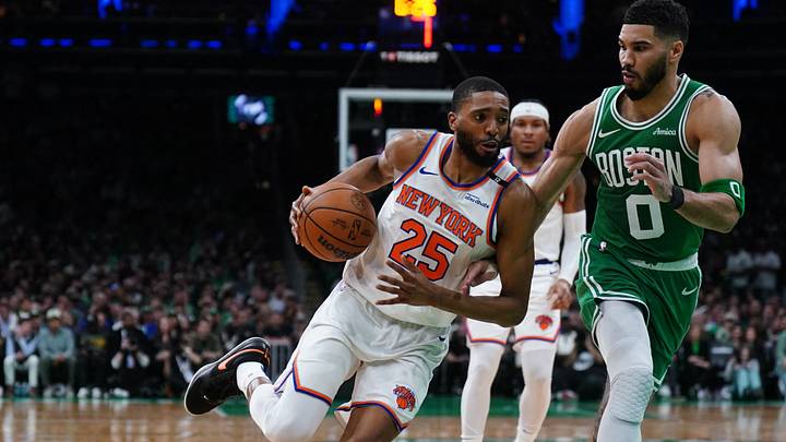 May 7, 2025; Boston, Massachusetts, USA; New York Knicks forward Mikal Bridges (25) drives the ball against Boston Celtics forward Jayson Tatum (0) in the second quarter during game two of the second round for the 2025 NBA Playoffs at TD Garden. Mandatory Credit: David Butler II-Imagn Images