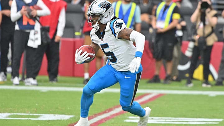 Sep 14, 2025; Glendale, Arizona, USA;  Carolina Panthers running back Rico Dowdle (5) runs the ball during the first quarter against the Arizona Cardinals at State Farm Stadium. Mandatory Credit: Matt Kartozian-Imagn Images