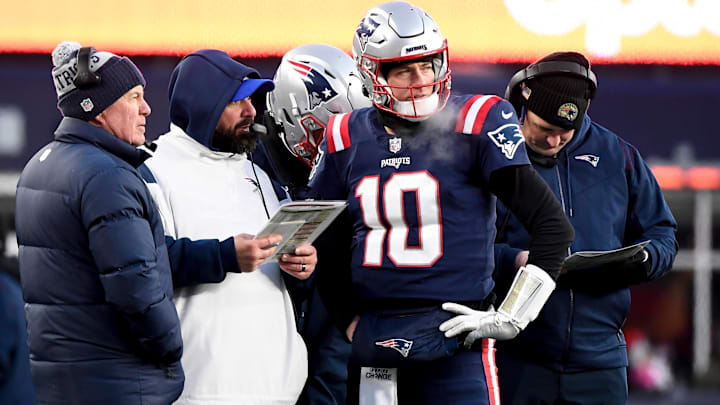Dec 24, 2022; Foxborough, Massachusetts, USA; New England Patriots quarterback Mac Jones (10) checks