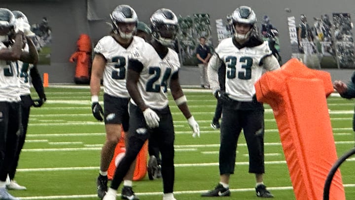 Cooper DeJean (No. 33) and rookie Drew Mukuba (No. 24) go through a drill during the Eagles' OTA practice on May 28, 2025. 