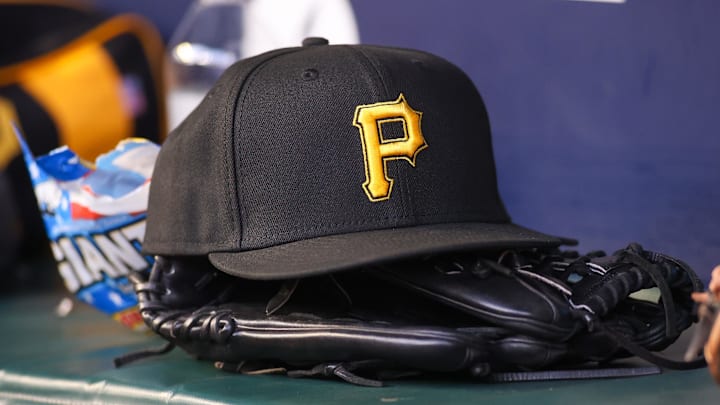 Sep 8, 2023; Atlanta, Georgia, USA; A detailed view of a Pittsburgh Pirates hat and glove before a game against the Pittsburgh Pirates in the first inning at Truist Park. Mandatory Credit: Brett Davis-Imagn Images