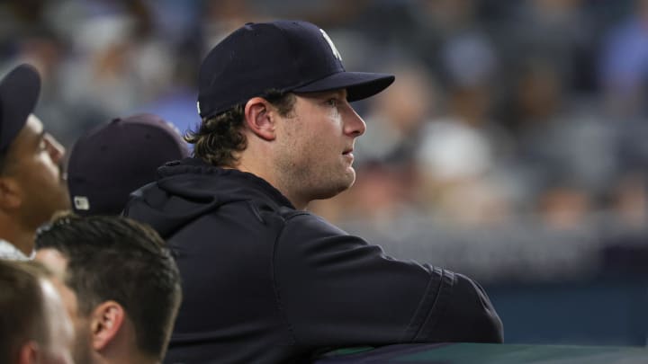 Jun 5, 2024; Bronx, New York, USA; New York Yankees pitcher Gerrit Cole (45) looks on from the dug out during the eighth inning against the Minnesota Twins at Yankee Stadium. Mandatory Credit: Vincent Carchietta-USA TODAY Sports