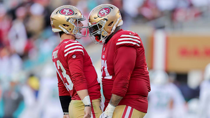Dec 4, 2022; Santa Clara, California, USA; San Francisco 49ers quarterback Brock Purdy (13) celebrates with offensive tackle Trent Williams (71) after a touchdown during the second quarter at Levi's Stadium. Mandatory Credit: Sergio Estrada-Imagn Images