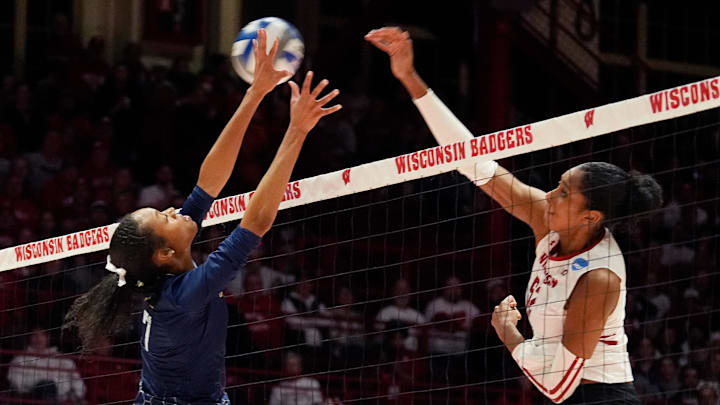 Georgia Tech middle blocker Logan Wiley (7) misses to block the hit against Wisconsin middle blocker Carter Booth (52) during the second set of the second-round match of the NCAA volleyball playoffs on Friday December 6, 2024 at the UW Field House in Madison, Wis.