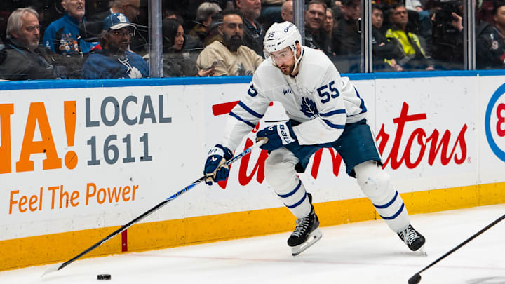 Jan 31, 2026; Vancouver, British Columbia, CAN; Toronto Maple Leafs forward Nicolas Roy (55) handles the puck against the Vancouver Canucks in the third period at Rogers Arena. Mandatory Credit: Bob Frid-Imagn Images