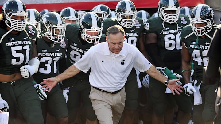 January 1, 2014; Pasadena, CA, USA; Michigan State Spartans head coach Mark Dantonio leads the Spartans to play against the Stanford Cardinal at Rose Bowl. Mandatory Credit: Gary A. Vasquez-Imagn Images
