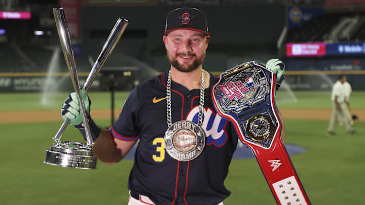 Jul 14, 2025; Atlanta, GA, USA; Seattle Mariners catcher Cal Raleigh (29) holds the trophy after winning the 2025 Home Run Derby at Truist Park. Mandatory Credit: Brett Davis-Imagn Images