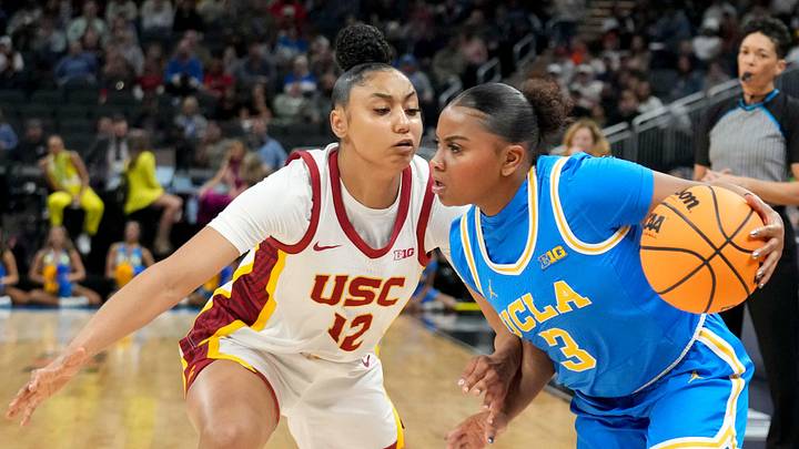 USC Trojans guard JuJu Watkins (12) guards UCLA Bruins guard Londynn Jones (3) during the first half of the 2025 TIAA Big Ten Women's Basketball Tournament final game on Sunday, March 9, 2025, at Gainbridge Fieldhouse in Indianapolis. UCLA defeated USC 72-67. USC Trojans guard JuJu Watkins (12) guards UCLA Bruins guard Londynn Jones (3) during the first half of the 2025 TIAA Big Ten Women's Basketball Tournament final game on Sunday, March 9, 2025, at Gainbridge Fieldhouse in Indianapolis. UCLA defeated USC 72-67.