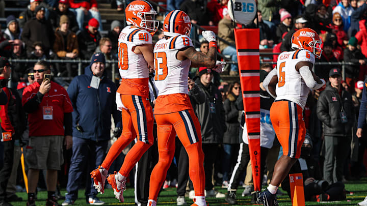 Nov 23, 2024; Piscataway, New Jersey, USA; Illinois Fighting Illini wide receiver Hank Beatty (80) celebrates his receiving touchdown with wide receiver Pat Bryant (13) during the first half against the Rutgers Scarlet Knights at SHI Stadium. Mandatory Credit: Vincent Carchietta-Imagn Images
