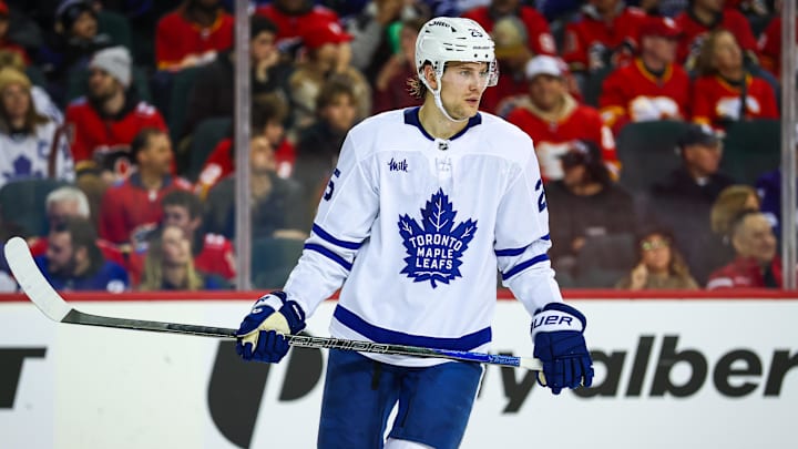 Feb 2, 2026; Calgary, Alberta, CAN; Toronto Maple Leafs defenseman Brandon Carlo (25) against the Calgary Flames during the second period at Scotiabank Saddledome. Mandatory Credit: Sergei Belski-Imagn Images
