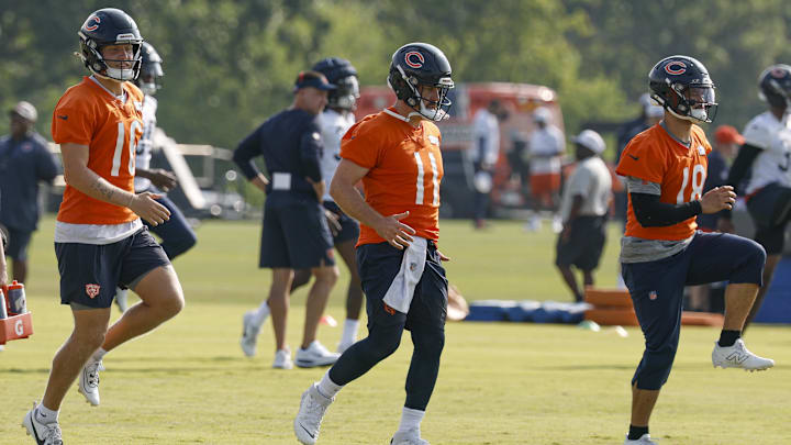 Jul 23, 2025; Lake Forest, IL, USA; Chicago Bears quarterbacks Austin Reed (16), Case Keenum (11) and Caleb Williams (18) warm up during training camp at Halas Hall. Mandatory Credit: Kamil Krzaczynski-Imagn Images