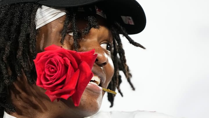 Ohio State Buckeyes wide receiver Jeremiah Smith (4) celebrates with a rose following the 41-21 win over the Oregon Ducks in the College Football Playoff quarterfinal at the Rose Bowl in Pasadena, Calif. on Jan. 1, 2025. Ohio State Buckeyes wide receiver Jeremiah Smith (4) celebrates with a rose following the 41-21 win over the Oregon Ducks in the College Football Playoff quarterfinal at the Rose Bowl in Pasadena, Calif. on Jan. 1, 2025.