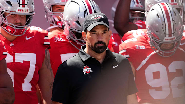 Ohio State Buckeyes head coach Ryan Day leads his team onto the field prior to the game against the Texas Longhorns.