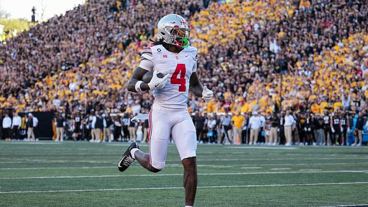Ohio State Buckeyes wide receiver Jeremiah Smith (4) scores a touchdown, breaking the school's all-time record, during the NCAA football game against the Iowa Hawkeyes at Kinnick Stadium in Iowa City on Oct. 3, 2026. Ohio State on 31-14. Ohio State Buckeyes wide receiver Jeremiah Smith (4) scores a touchdown, breaking the school's all-time record, during the NCAA football game against the Iowa Hawkeyes at Kinnick Stadium in Iowa City on Oct. 3, 2026. Ohio State on 31-14.