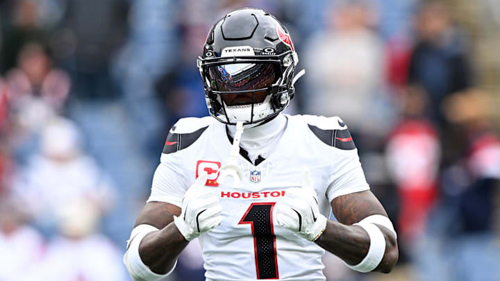Oct 13, 2024; Foxborough, Massachusetts, USA; Houston Texans wide receiver Stefon Diggs (1) reacts before a game against the New England Patriots at Gillette Stadium. Mandatory Credit: Brian Fluharty-Imagn Images