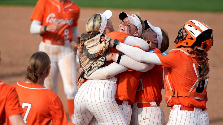Oklahoma State Cowgirls pitcher Ruby Meylan celebrates with teammates. Oklahoma State Cowgirls pitcher Ruby Meylan celebrates with teammates.