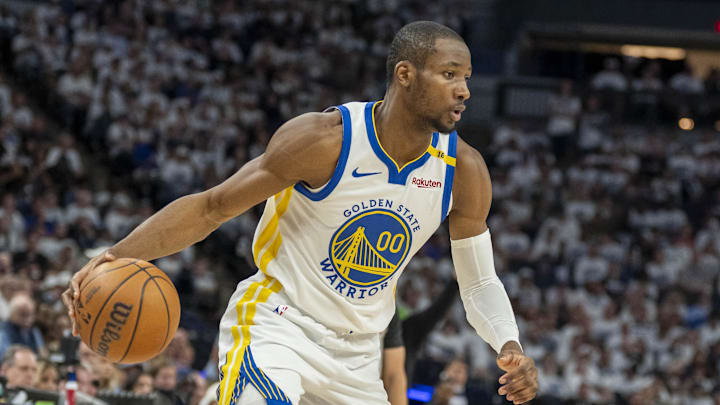 May 8, 2025; Minneapolis, Minnesota, USA; Golden State Warriors forward Jonathan Kuminga (00) dribbles the ball against the Minnesota Timberwolves in the second half during game two of the second round for the 2025 NBA Playoffs at Target Center. Mandatory Credit: Jesse Johnson-Imagn Images