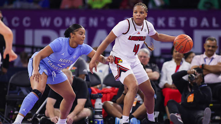 Mar 7, 2026; Duluth, GA, USA; Louisville Cardinals forward MacKenly Randolph (4) is defended by North Carolina Tar Heels forward Nyla Harris (2) in the second quarter at Gas South Arena. Mandatory Credit: Brett Davis-Imagn Images