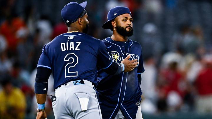 Aug 5, 2025; Anaheim, California, USA; Tampa Bay Rays first baseman Yandy Diaz (2) and third baseman Junior Caminero (13) celebrate after the game against the Los Angeles Angels at Angel Stadium of Anaheim. Aug 5, 2025; Anaheim, California, USA; Tampa Bay Rays first baseman Yandy Diaz (2) and third baseman Junior Caminero (13) celebrate after the game against the Los Angeles Angels at Angel Stadium of Anaheim.