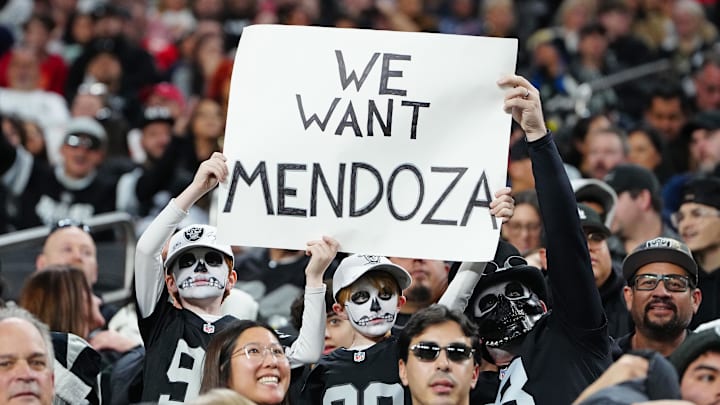 Jan 4, 2026; Paradise, Nevada, USA; Las Vegas Raiders fans hold a sign during a game between the Raiders and the Kansas City Chiefs in the fourth quarter at Allegiant Stadium. Mandatory Credit: Stephen R. Sylvanie-Imagn Images