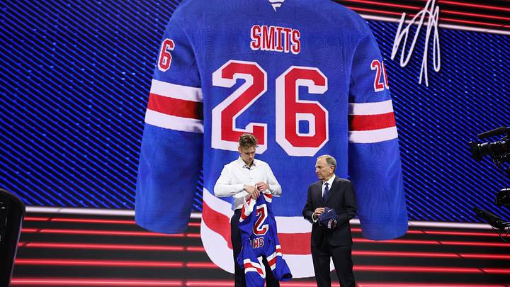 Jun 26, 2026; Buffalo, New York, USA; Alberts Smits reacts beside NHL commissioner Gary Bettman after being selected with the fifth pick in the first round of the 2026 NHL Draft by the New York Rangers at KeyBank Center. Mandatory Credit: Timothy T. Ludwig-Imagn Images