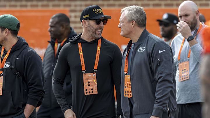 Jan 28, 2025; Mobile, AL, USA; Washington Commanders general manger Adam Peters reunites with former boss John Lynch during Senior Bowl practice for the American team at Hancock Whitney Stadium. Lynch is the general manager of the San Francisco 49ers. Mandatory Credit: Vasha Hunt-Imagn Images