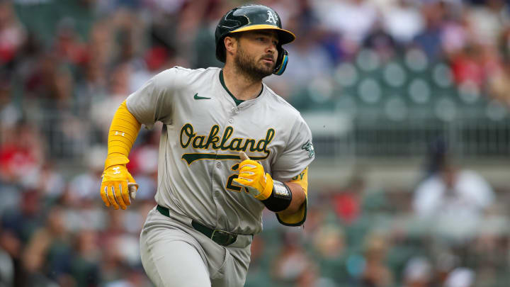 Jun 1, 2024; Atlanta, Georgia, USA; Oakland Athletics catcher Shea Langeliers (23) hits a single against the Atlanta Braves in the first inning at Truist Park.