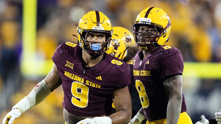 Nov 28, 2025; Tempe, Arizona, USA; Arizona State Sun Devils defensive lineman Elijah O'Neal (9) and linebacker Jordan Crook (8) against the Arizona Wildcats during the 99th Territorial Cup at Mountain America Stadium. Mandatory Credit: Mark J. Rebilas-Imagn Images