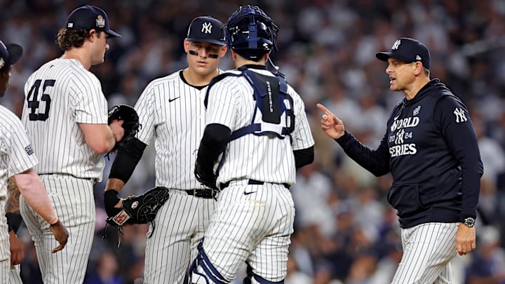 Oct 30, 2024; New York, New York, USA; New York Yankees manager Aaron Boone (17) relieves pitcher Gerrit Cole (45) during the seventh inning against the Los Angeles Dodgers in game four of the 2024 MLB World Series at Yankee Stadium.
