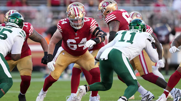 Sep 9, 2024; Santa Clara, California, USA; San Francisco 49ers center Jake Brendel (64) blocks against New York Jets linebacker Jermaine Johnson (11) during the second quarter at Levi's Stadium. Mandatory Credit: Darren Yamashita-Imagn Images