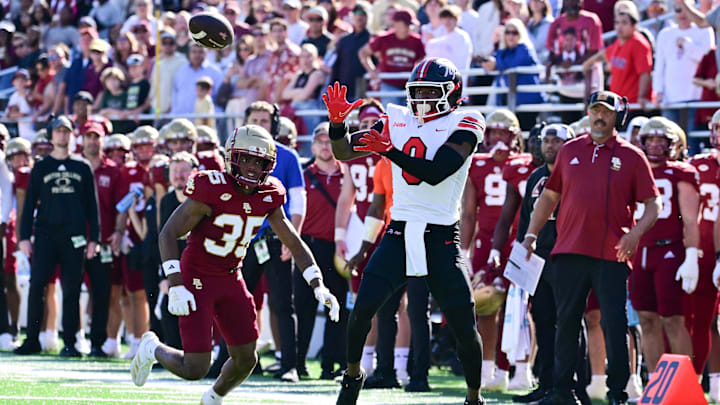 Sep 28, 2024; Chestnut Hill, Massachusetts, USA; Western Kentucky Hilltoppers wide receiver Kisean Johnson (0) tries to make a catch with pressure from Boston College Eagles defensive back Ashton McShane (35) during the second half at Alumni Stadium. Mandatory Credit: Eric Canha-Imagn Images
