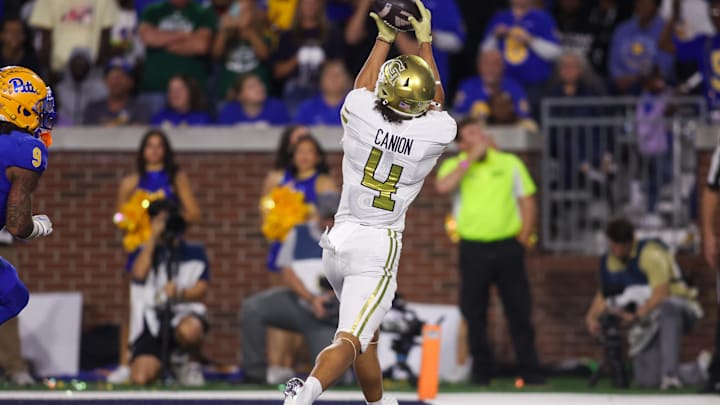 Nov 22, 2025; Atlanta, Georgia, USA; Georgia Tech Yellow Jackets wide receiver Isiah Canion (4) catches a pass for a touchdown against the Pittsburgh Panthers in the second quarter at Bobby Dodd Stadium at Hyundai Field. Mandatory Credit: Brett Davis-Imagn Images
