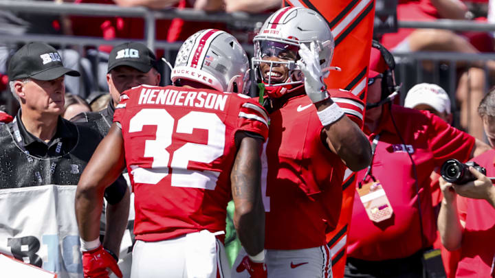 Sep 21, 2024; Columbus, Ohio, USA; Ohio State Buckeyes running back TreVeyon Henderson (32) celebrates the touchdown with running back Quinshon Judkins (1) during the second quarter against the Marshall Thundering Herd at Ohio Stadium. 
